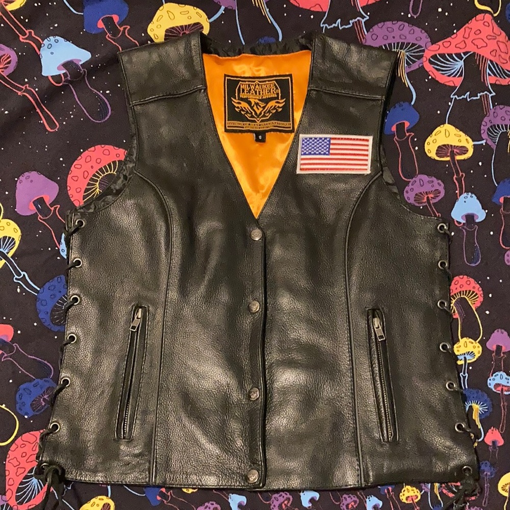 Black leather vest with American flag patch